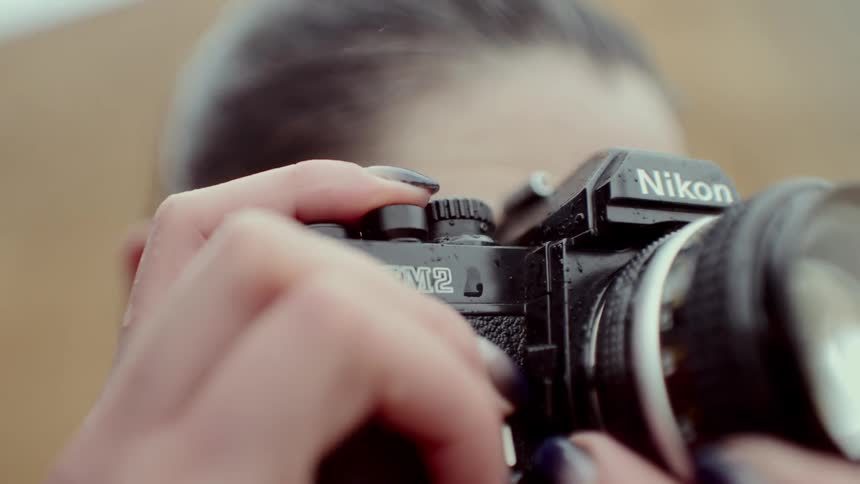 The woman is taking a photograph