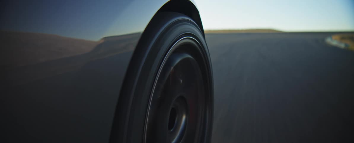 The car speeds down the track