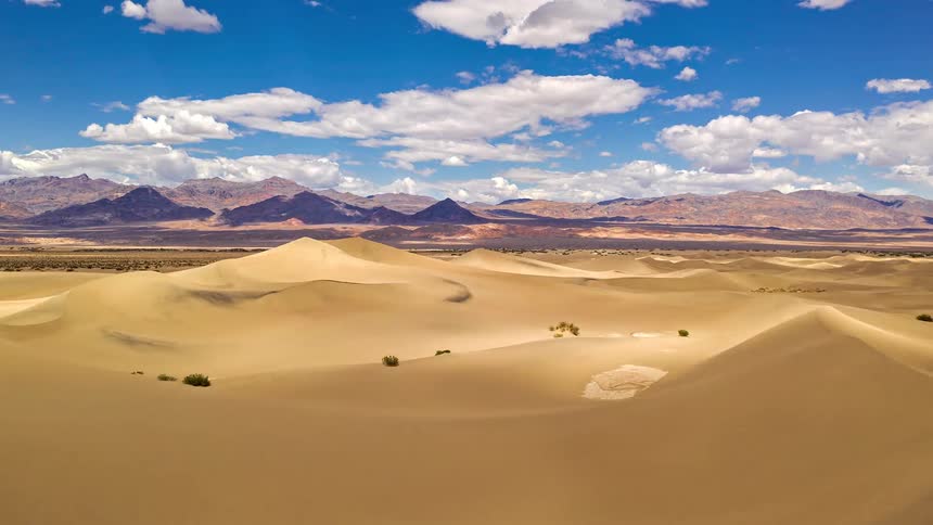 An aerial view of dunes in a desert