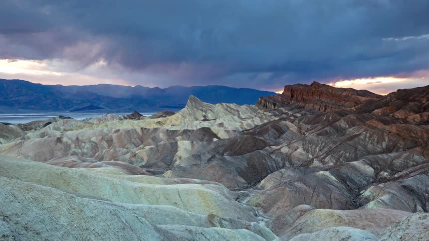 A view of a landscape with clouds above it