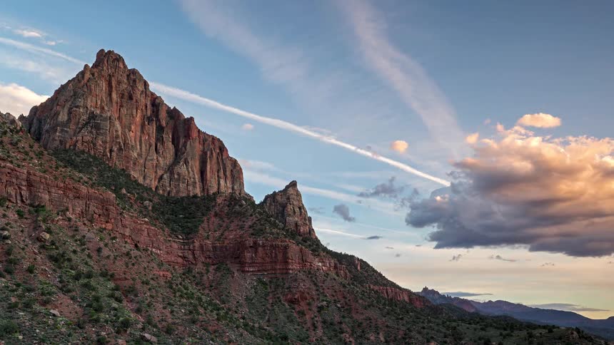 A time lapse of a sunset over a mountain