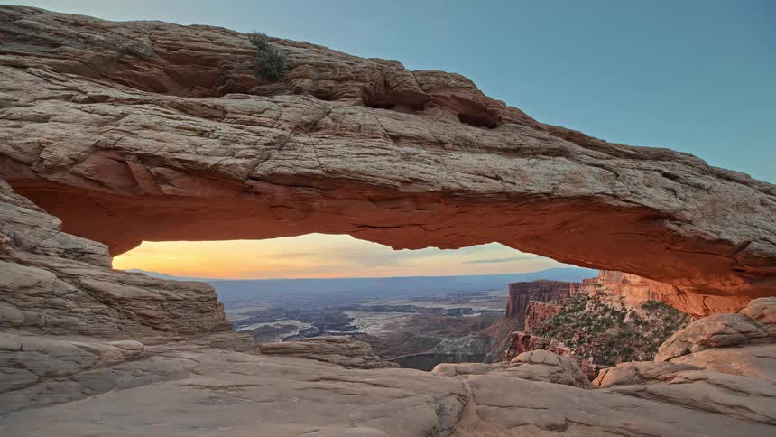 A view of a sunset at a rock