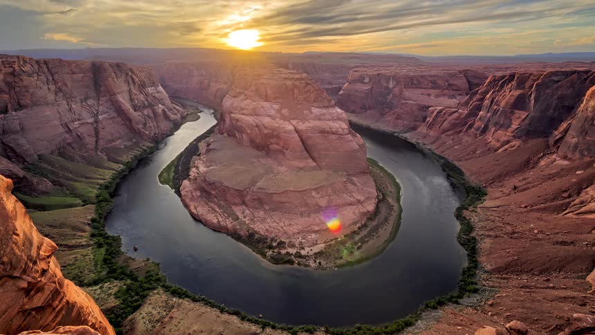 The ring of water goes around the rock formations