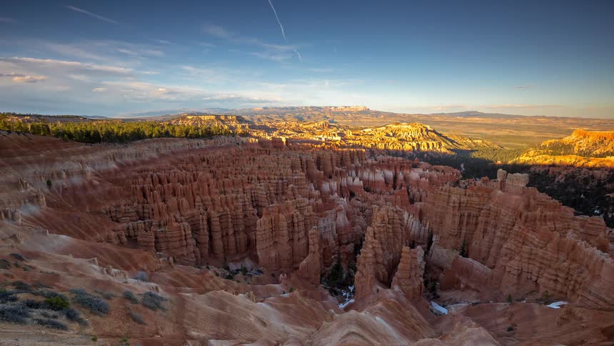 Sun sets in the canyon lighting up a series of choppy rock formations