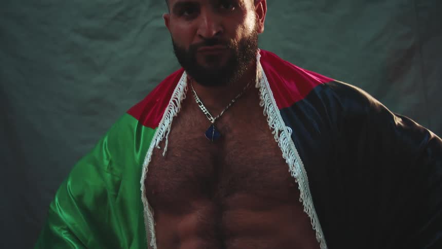 The man is posing without a shirt on