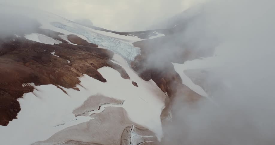 A view of a mountain range covered in snow