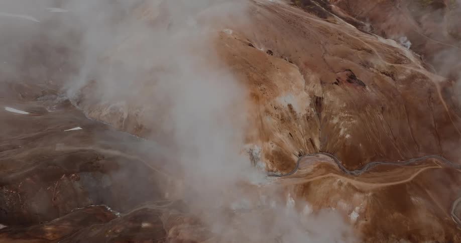 An aerial view of steam in mountains