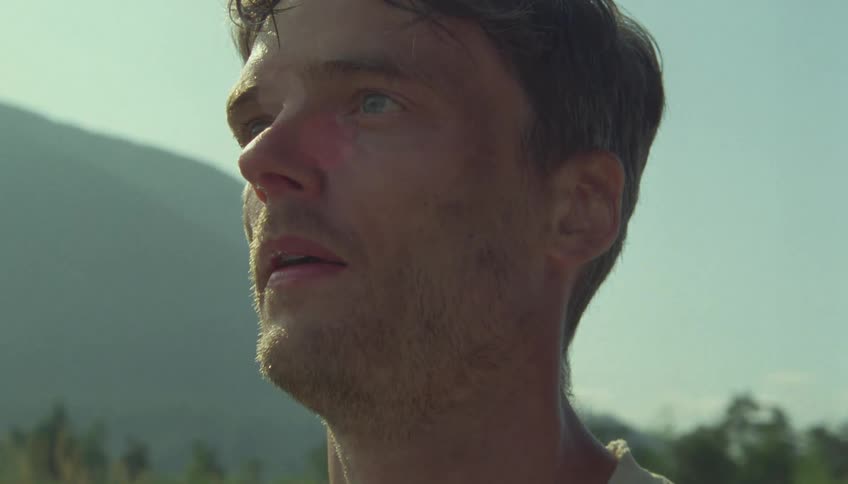 The man is sweating on a sunny day