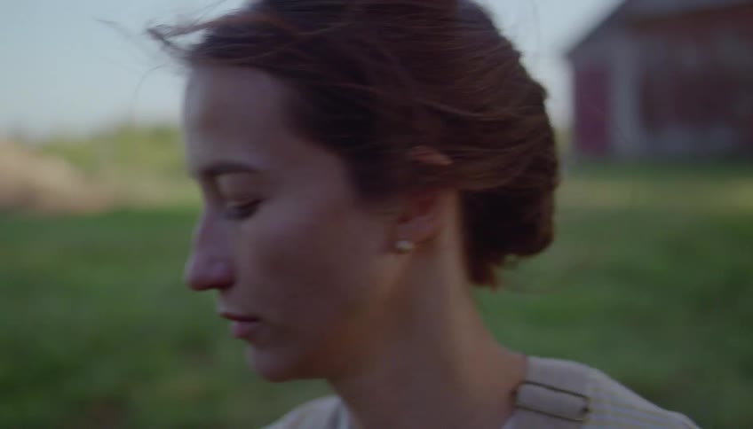 A woman and man working on a farm where the woman looks mad