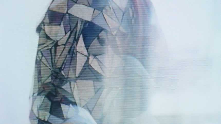 Human face covered by a translucent geometric structure under intense lighting