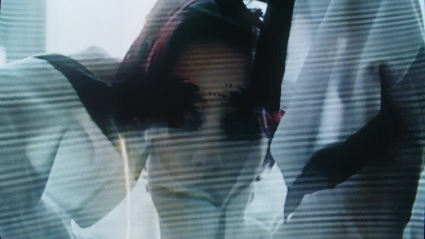 A woman with makeup on in a room