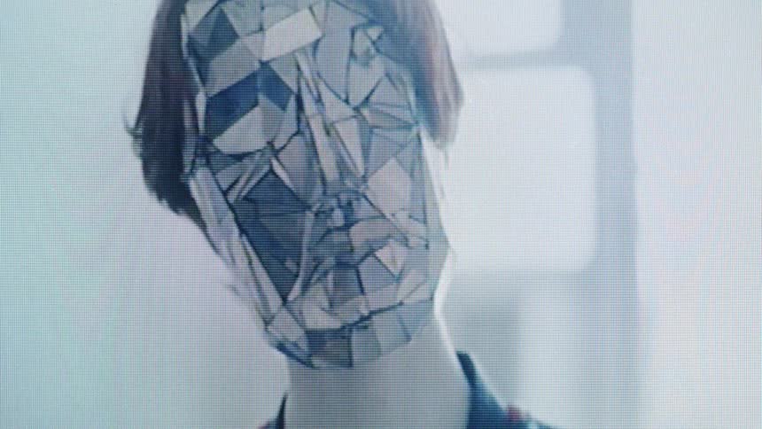 Humanoid with mirror pieces fitting together like a puzzle covering their face