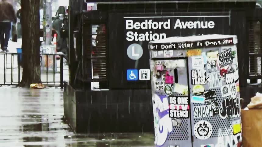 Bedford avenue station entrance with rainsoaked sidewalk