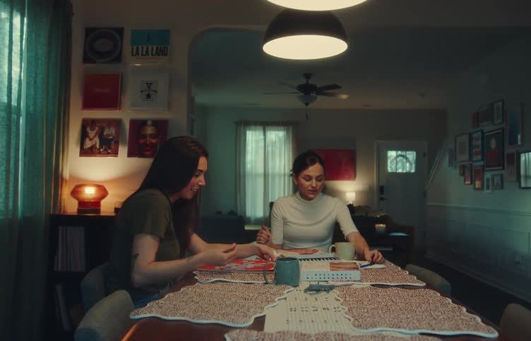 Two women sitting at a table talking