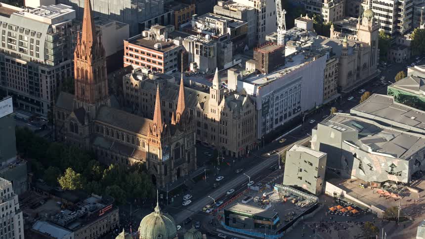 A time lapse of a busy street in an urban area crowded with buildings