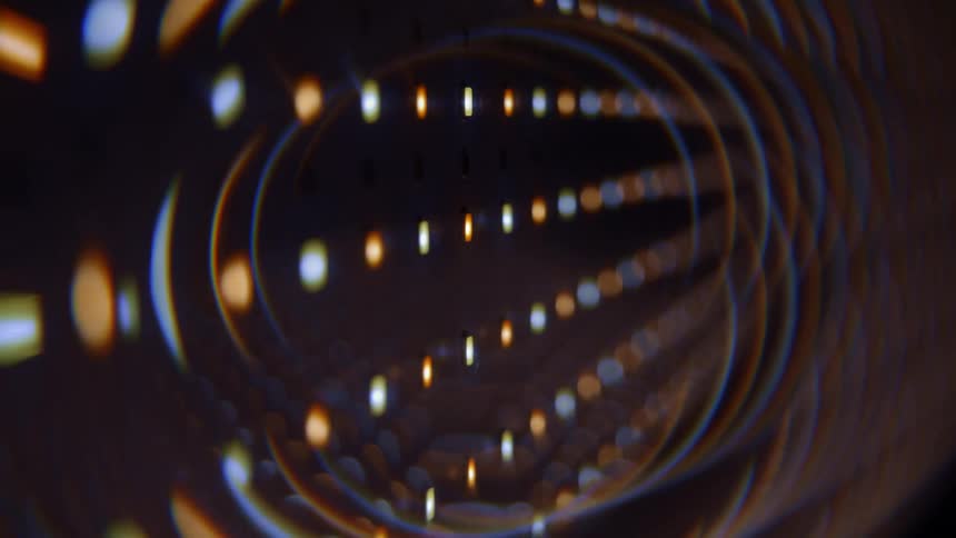 Bright colorful spots form a pattern that includes colored arcs