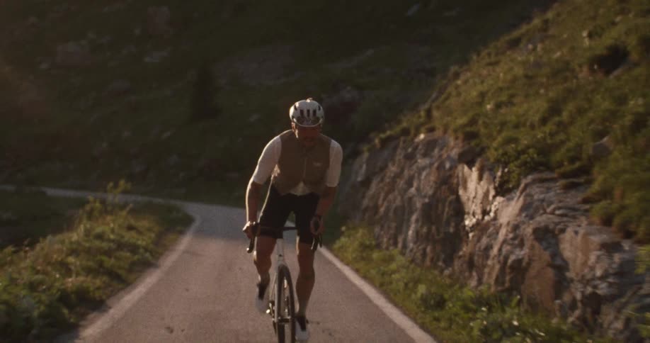 A man riding a bicycle up a mountain