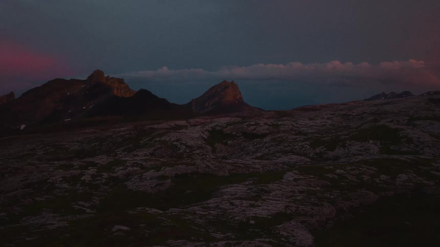 Sunset seen from atop a snowy mountain