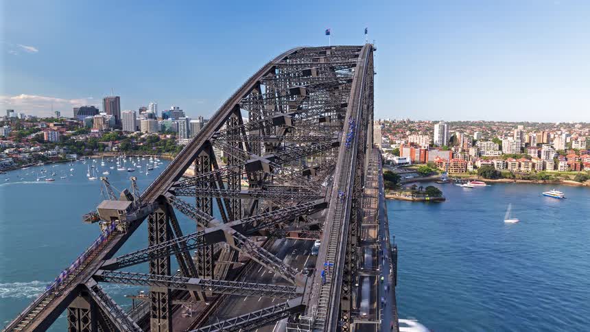 A sped up view of a bridge in a large city