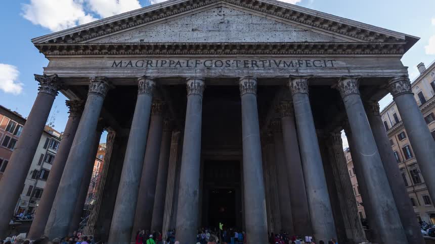 A large crowd of people gathering in front of the pantheon in rome on a sunny day