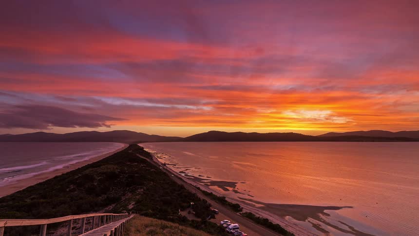 A time lapse of a sunset over a coast