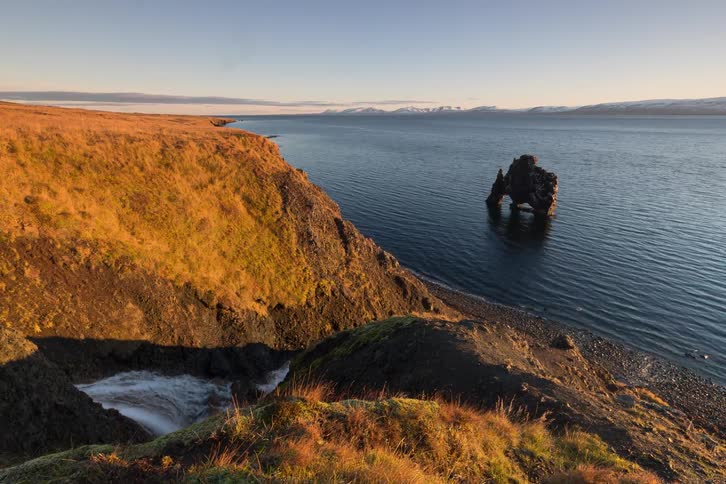 A view of a coast with hills