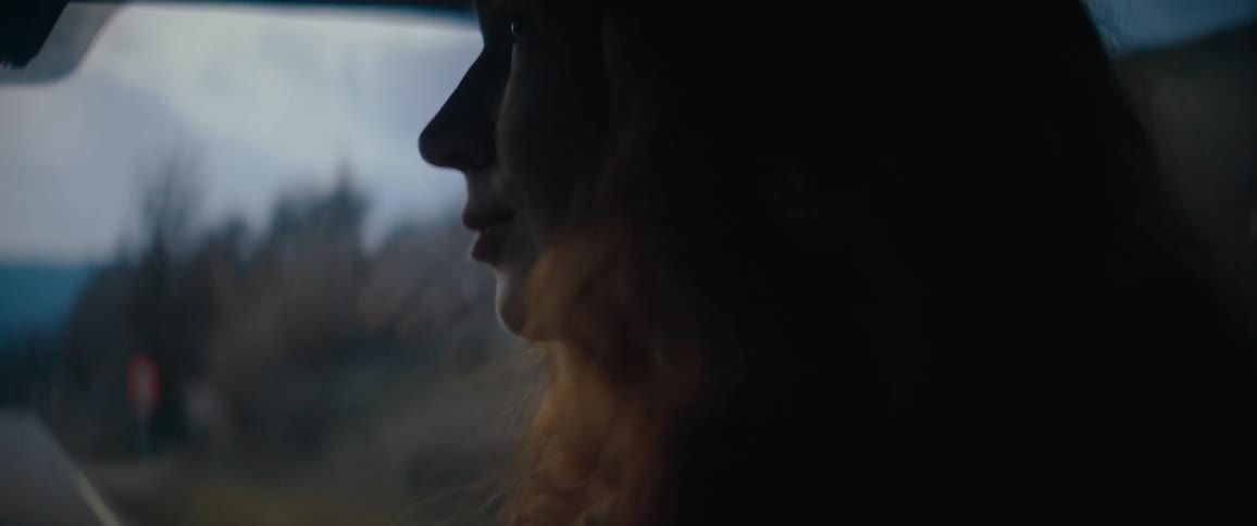A woman riding in a car