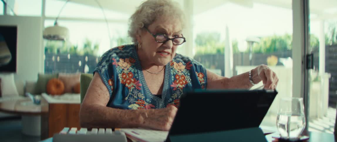 A woman looking at something on a computer