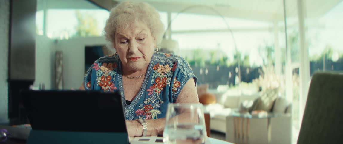 A woman sitting and using a laptop