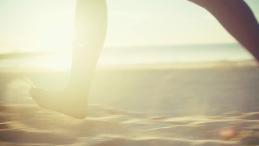 A woman running on a beach