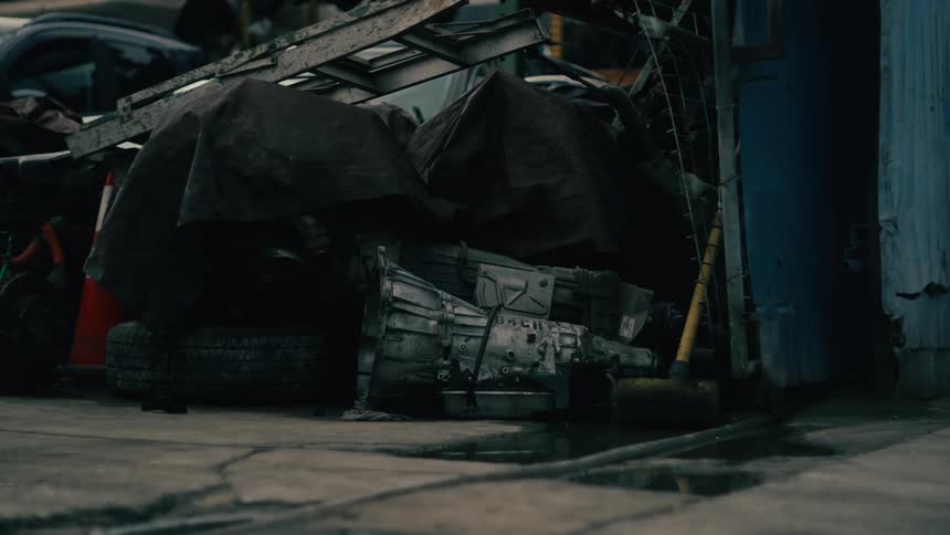 A transmission and supplies on a floor