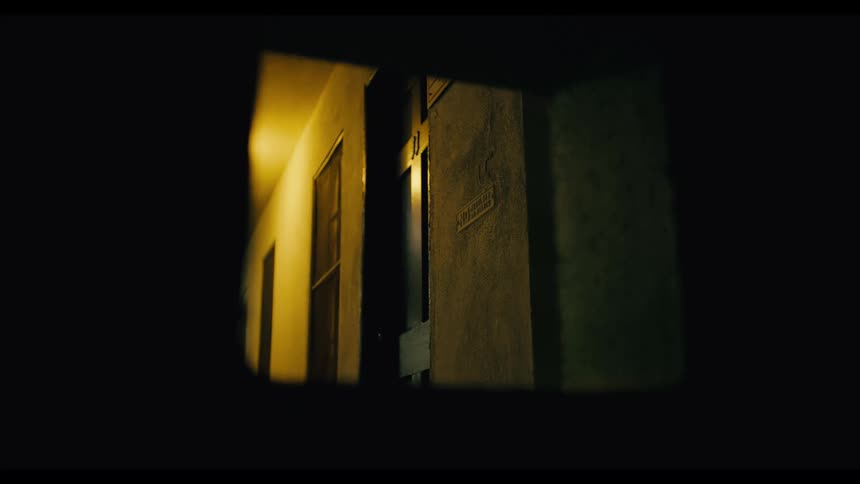 Ceiling light illuminates a shutter with a symbol and a label