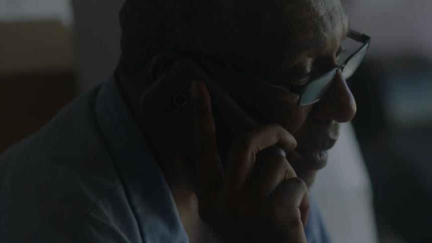 A man talks on a smartphone