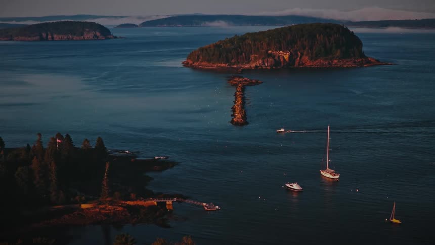 A boat moves through the water near a port
