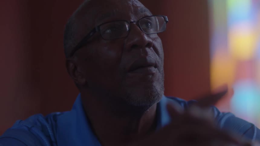 A man sits in a church
