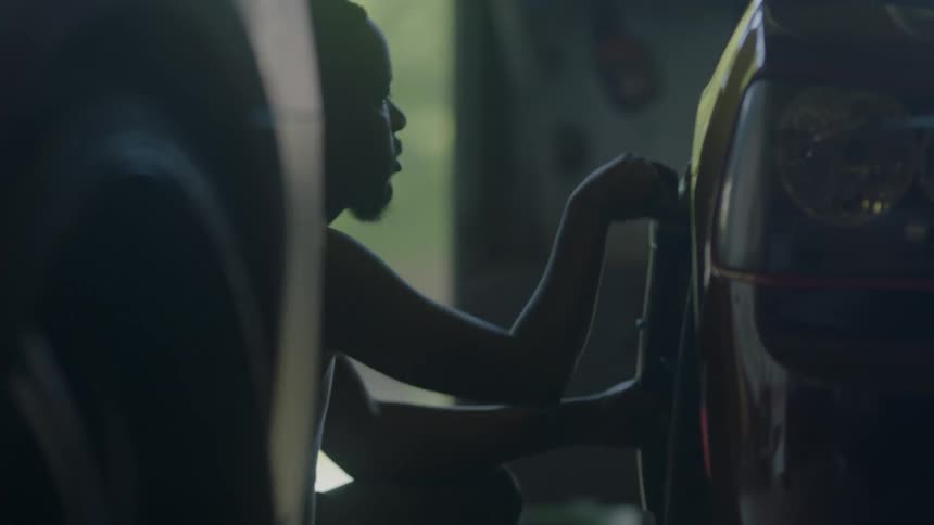 A man is buffing a car