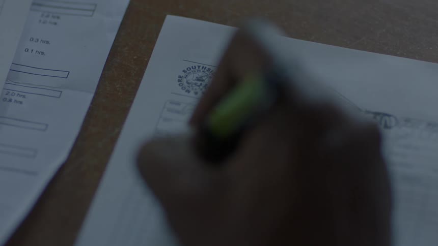 Person fills out a form