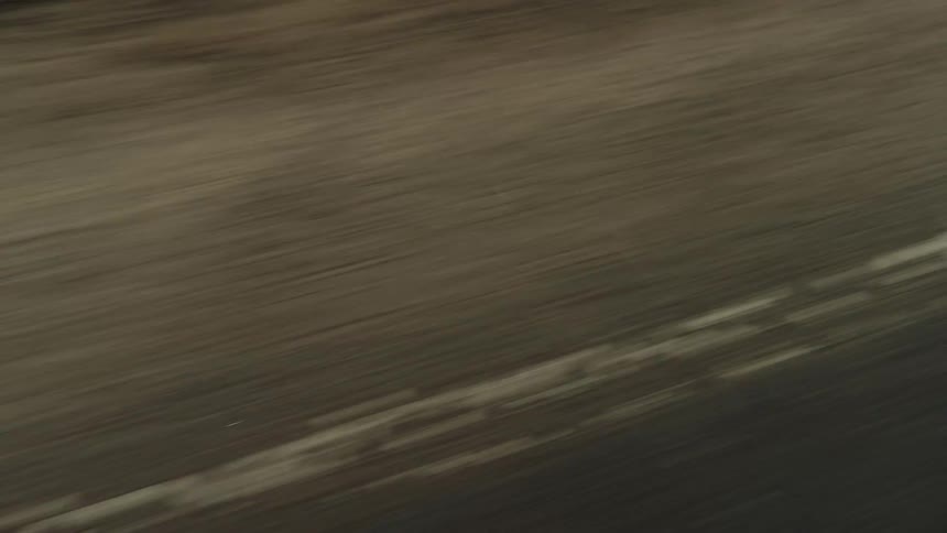 A moving road surface at daytime