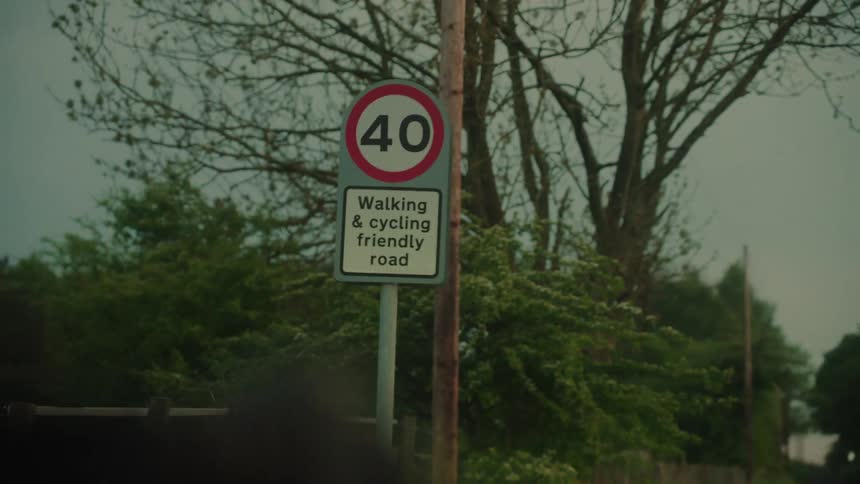 40 speed limit sign indicates a walking and cycling friendly road among trees
