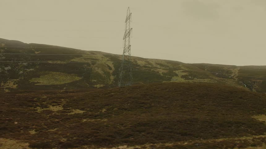 Power lines are strung across mountains