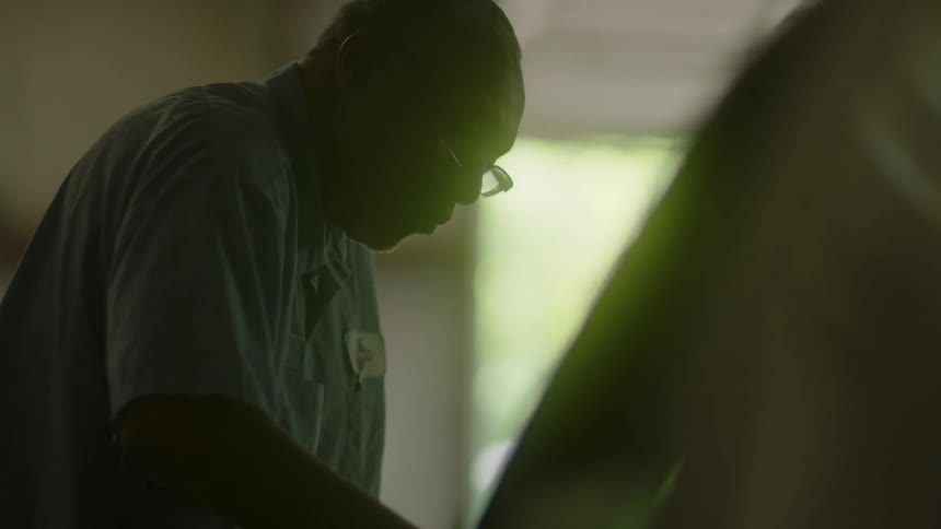 A man works in a garage