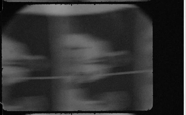 Magnifying glass viewing black and white photographs