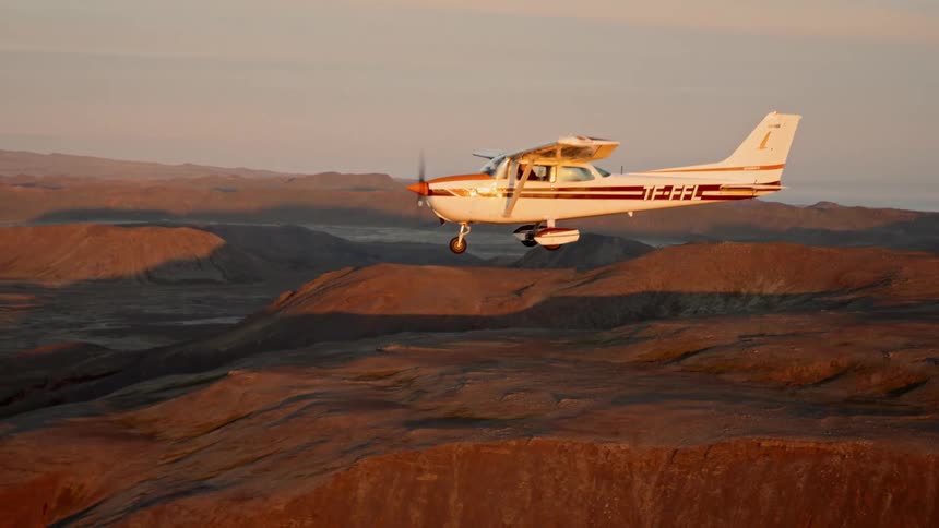 Singleengine plane flying through mountains
