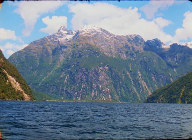A mountain at the edge of a lake