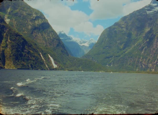 River rapids flowing with mountains along the coast