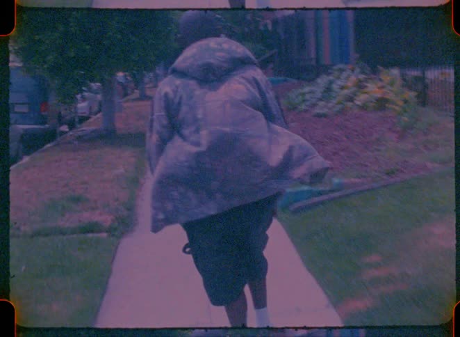 A man skateboarding down a road