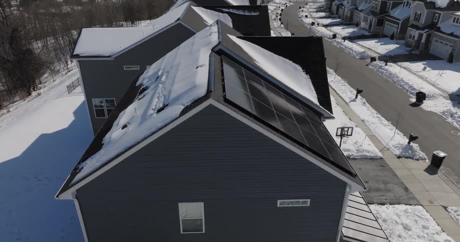 Snow covers the suburban town