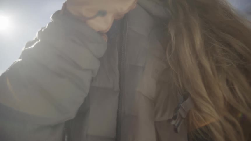Woman zipping up her jacket