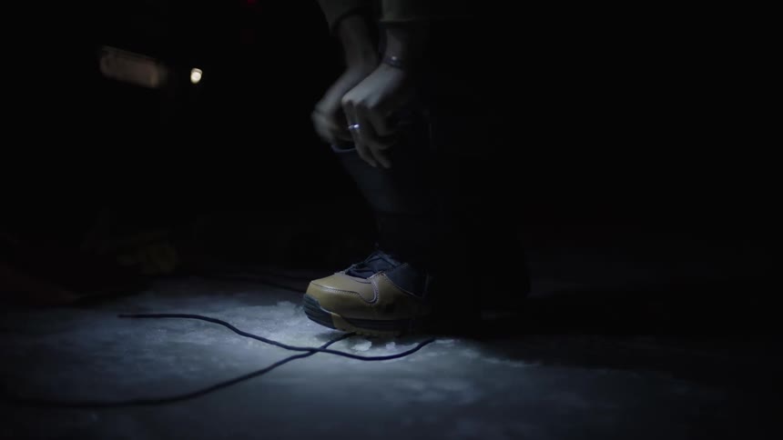 Person puts on a boot