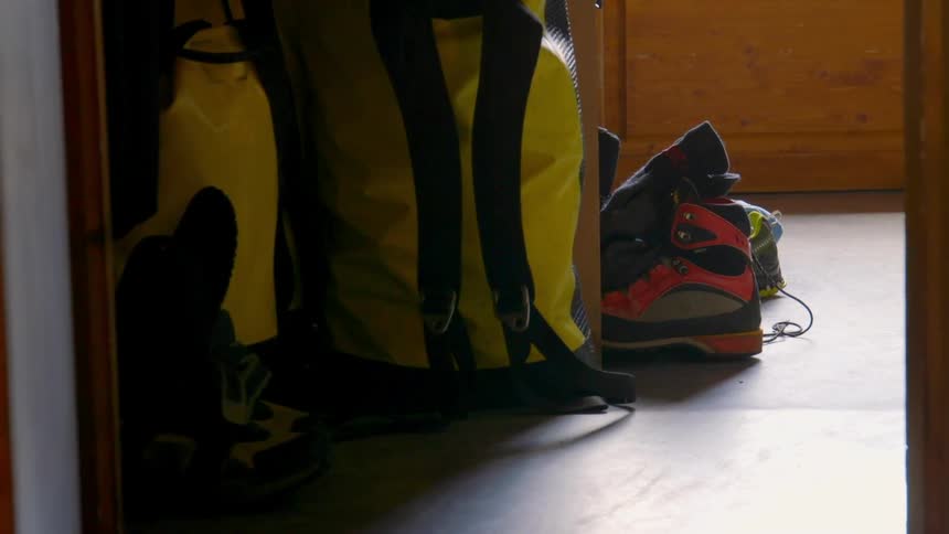 Hiking equipment on the floor of a room